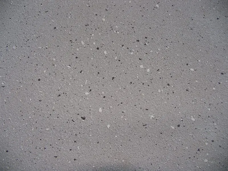 Close-up of a grey speckled decorative concrete finish