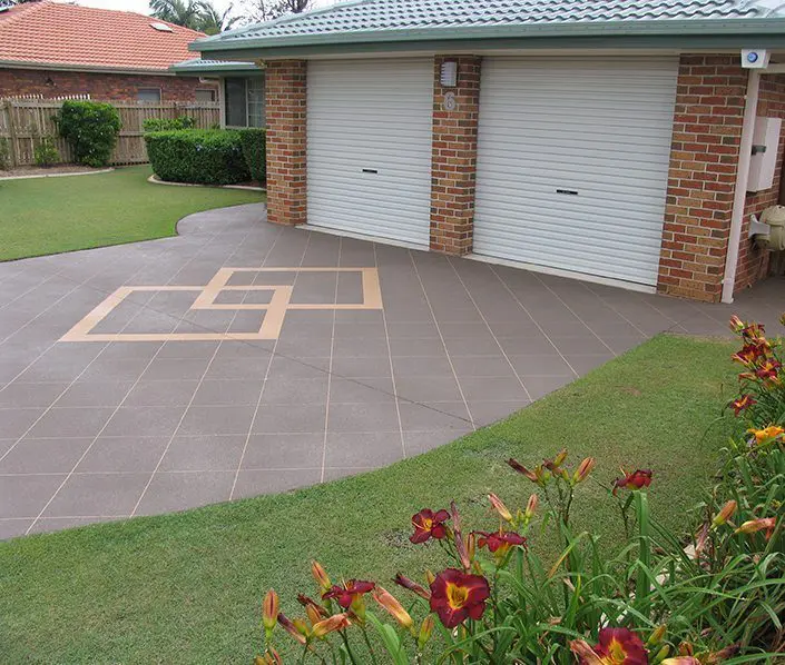 Taupe stencilled concrete driveway with an interlocking diamond feature inlay